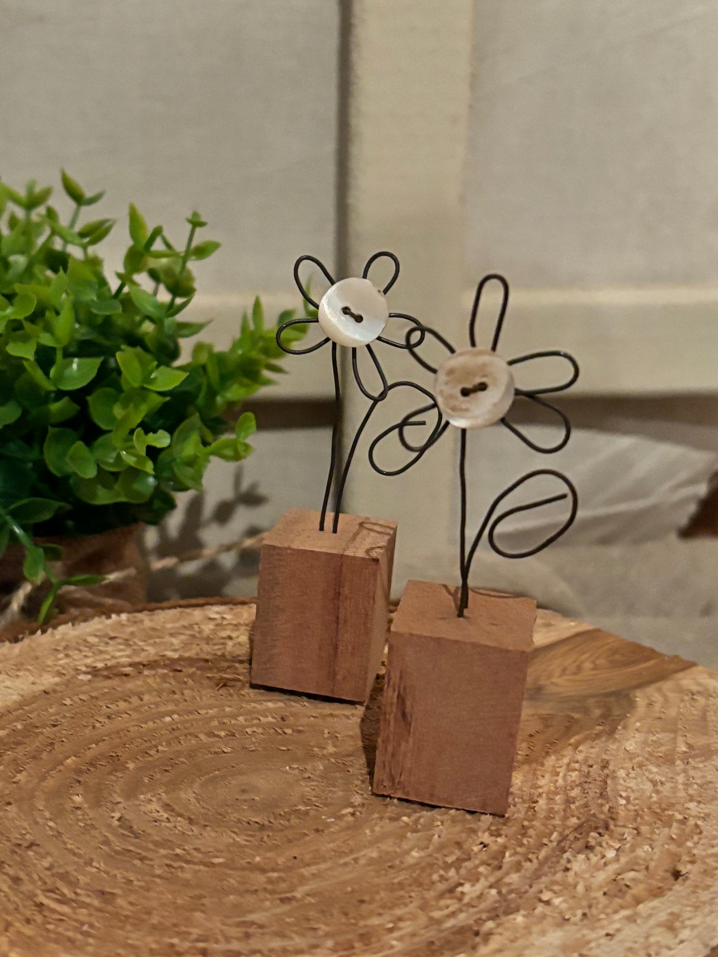 Wire flower in a wooden block