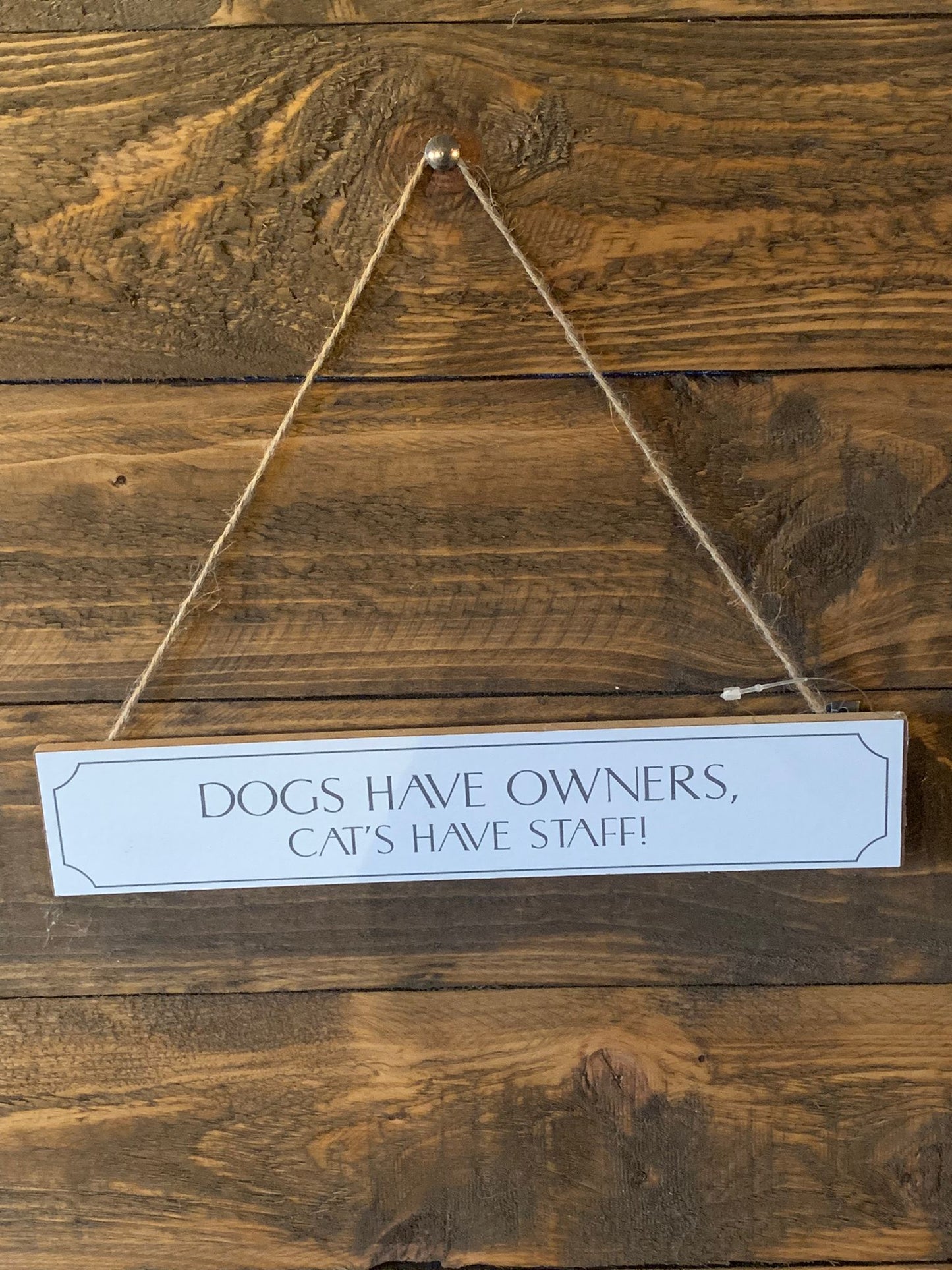 Dogs have owners ... wooden sign